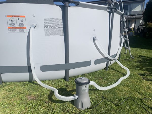 Filter pump and hoses connected to Bestway above-ground pool