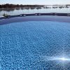 Surface shot showing sparkling blue water in above-ground pool