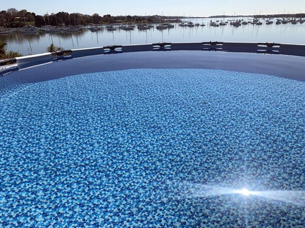 Surface shot showing sparkling blue water in above-ground pool