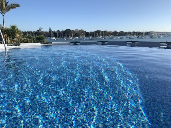 Clear water in Bestway above-ground pool with marina view
